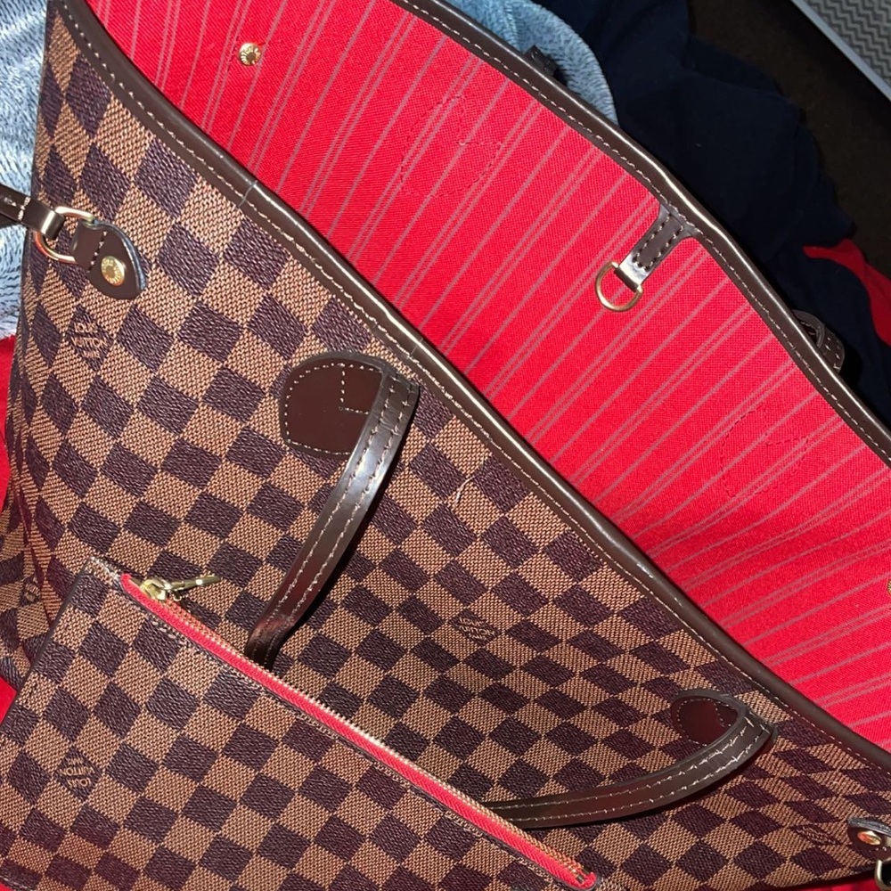 Large Louis Vuitton purse red on the inside brown on the outside gently used